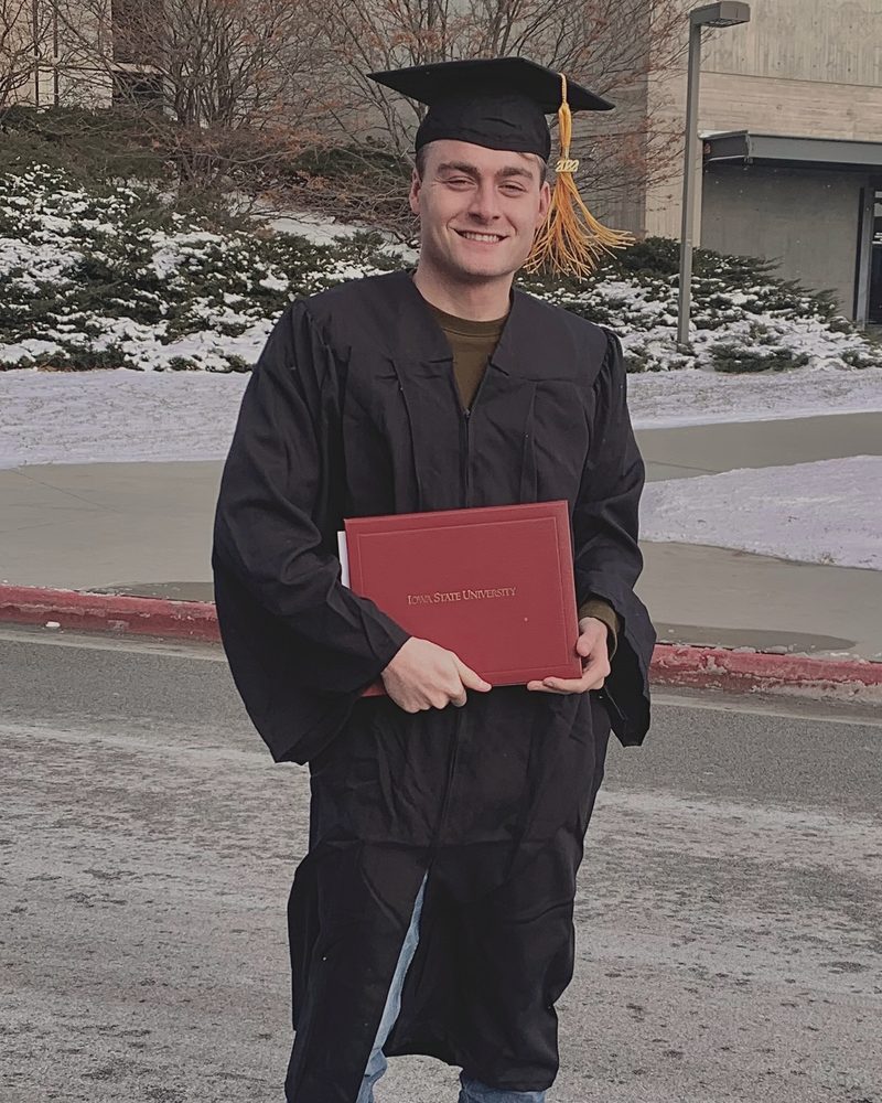 Max Smith in cap and gown at his Iowa State University graduation in Ames, Iowa, December 2022